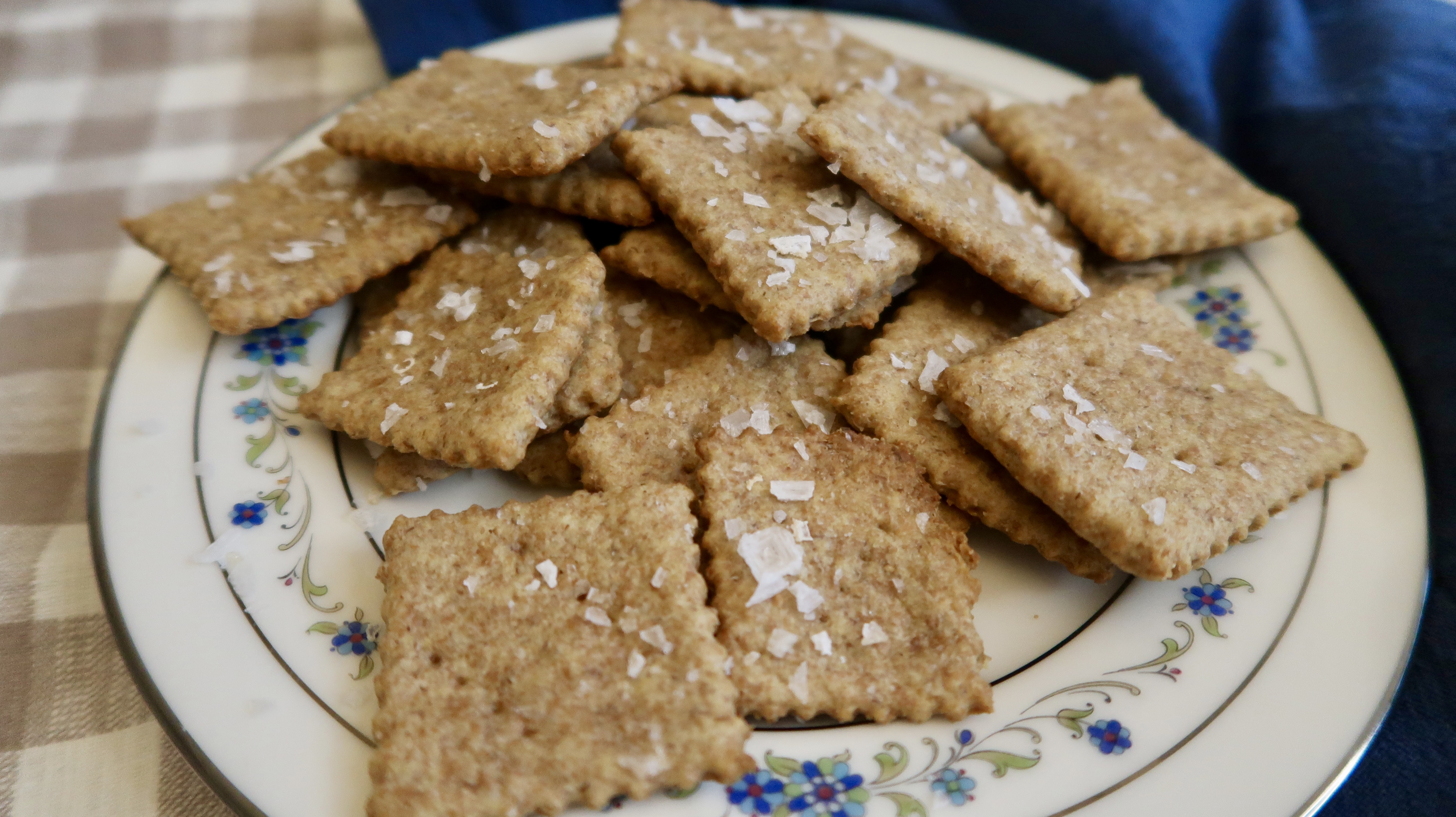 Fresh-milled spelt saltine crackers on a baking sheet