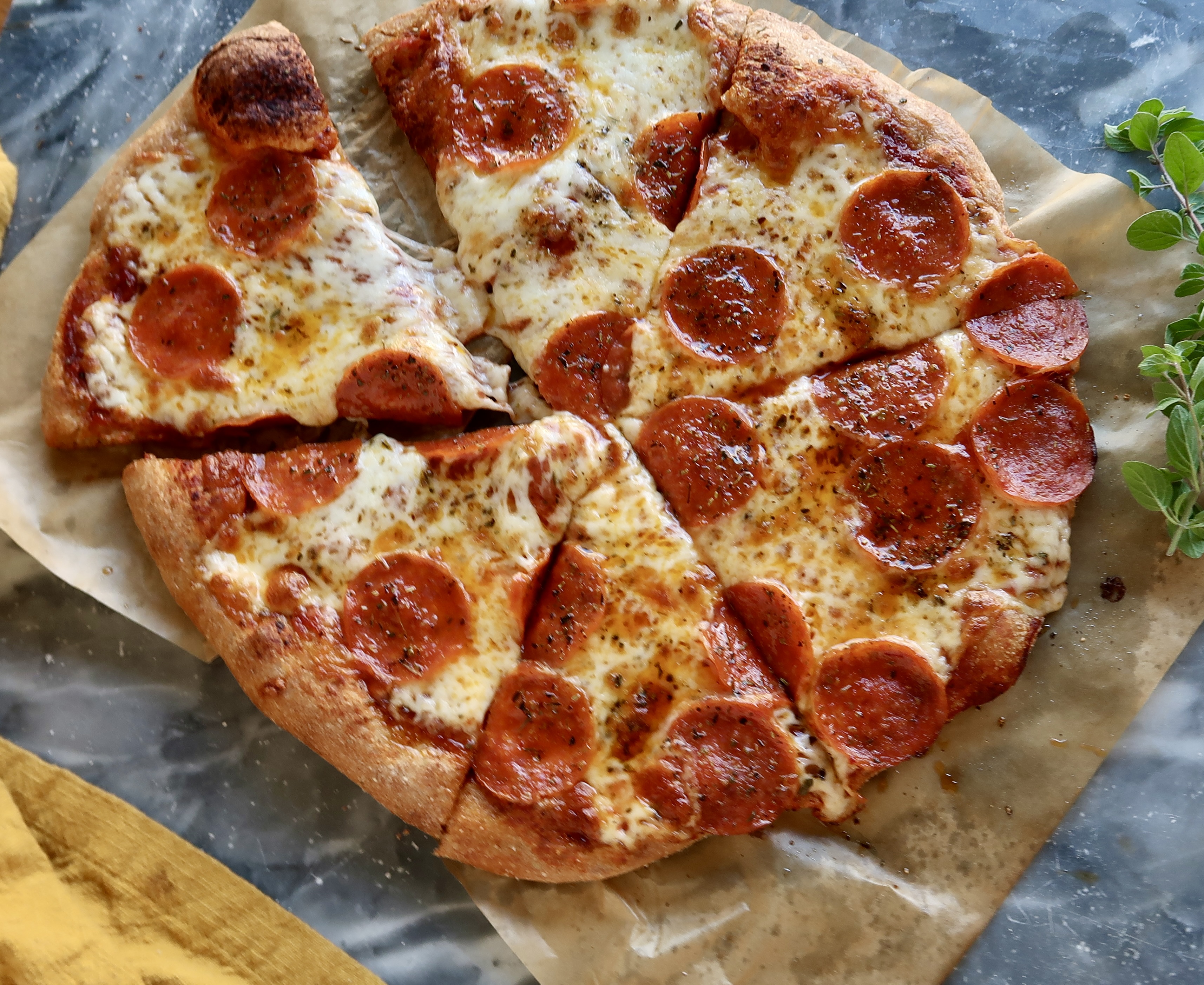 Fresh-milled spelt pizza dough on marble slab